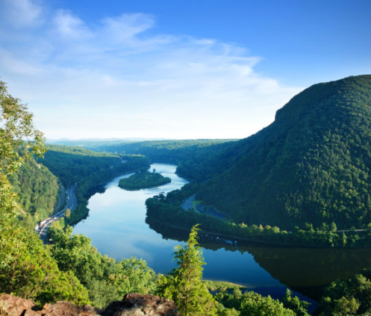 Mountain peak view with blue sky, river and trees from Delaware Water Gap, Pennsylvania.